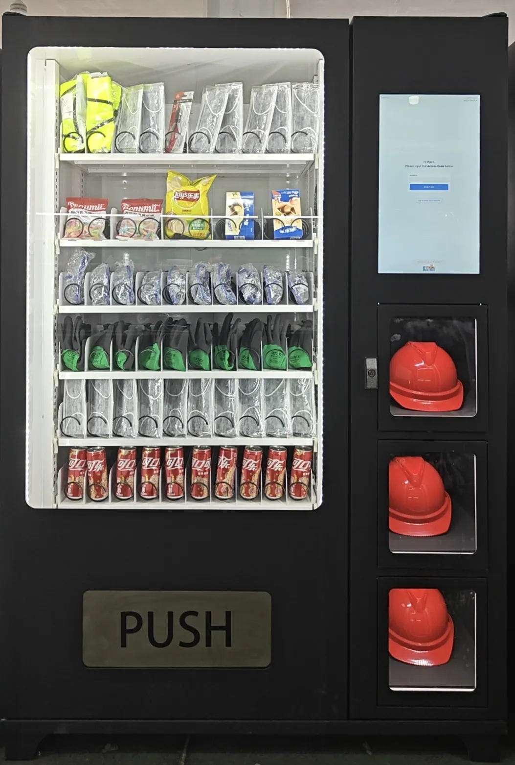 Industrial point-of-use vending machine with a touchscreen, access-card reader and stocked PPE behind a glass front